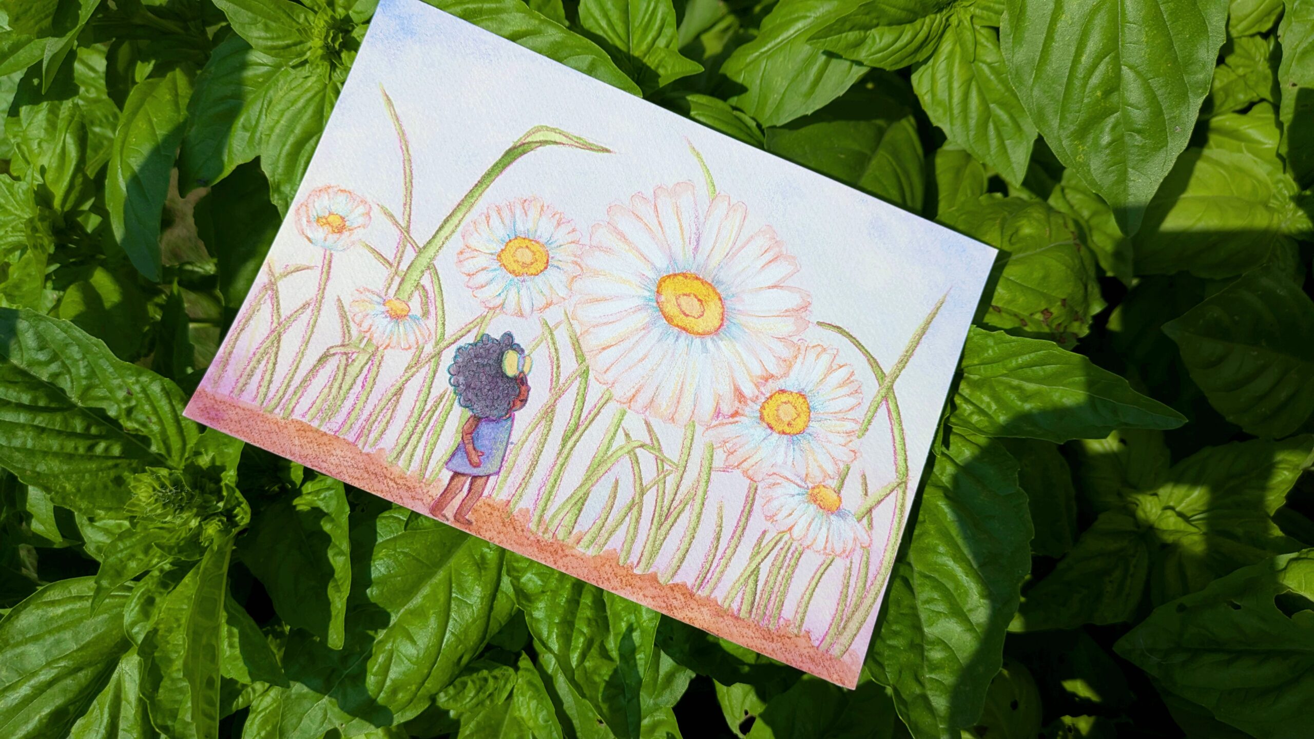 A whimsical painting of a little black girl surrounded by large daisies lies on a patch of basil on a sunny day.