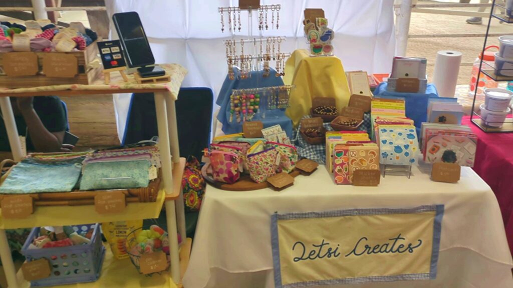 a booth set up at a market for small businesses